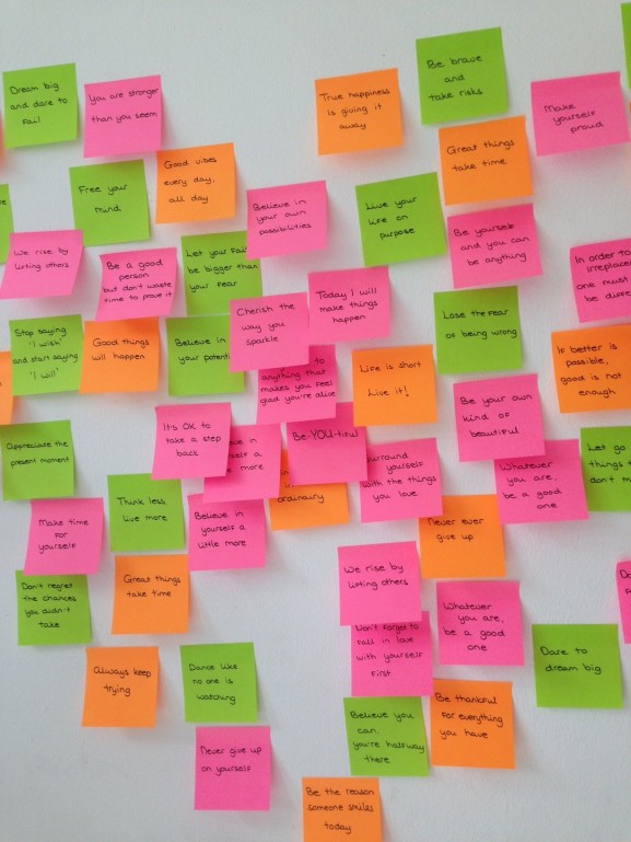 Wall with quotes dreams on postits